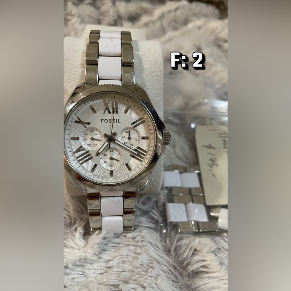 White and Silver Fossil Watch with White face.